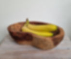 Teak root rustic wooden bowl, hand carved oval shaped, shown with bananas for scale