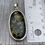 Thumbnail: Large oval green amber pendant