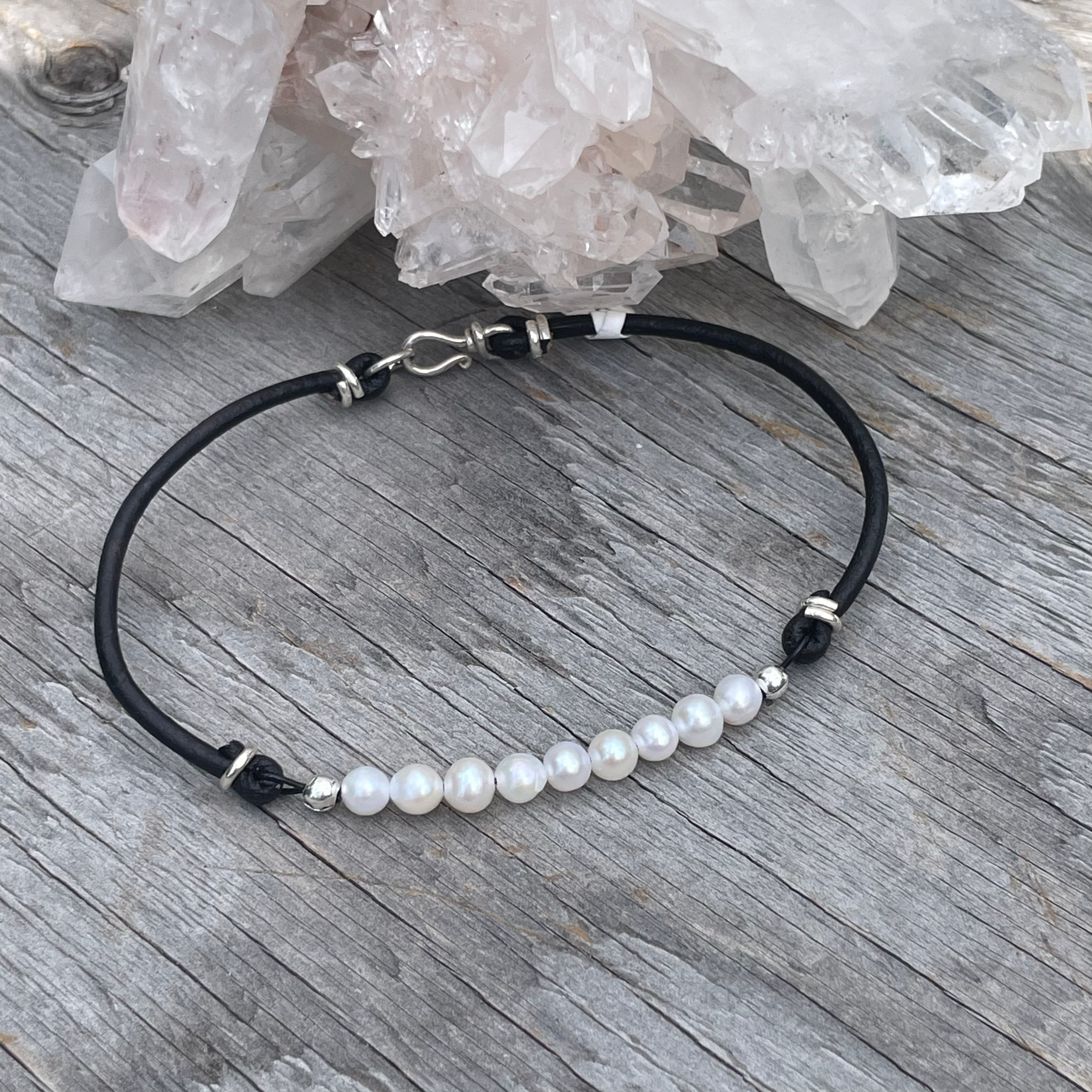 Pearls and black leather bracelet