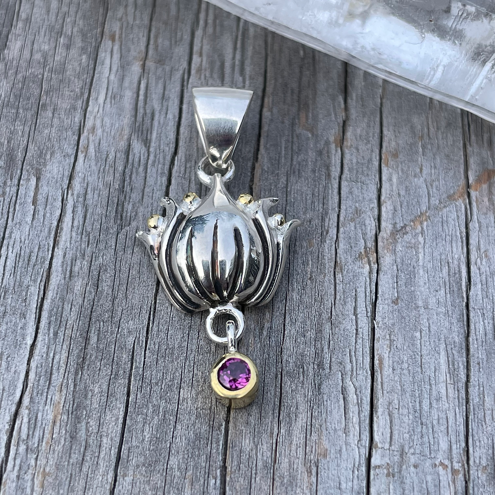 Thumbnail: Roulette 18 lotus with garnet dangle pendant