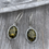Thumbnail: Green Amber ovals with braided setting earrings