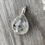 Thumbnail: Wide teardrop fully faceted tourmaline in quartz pendant