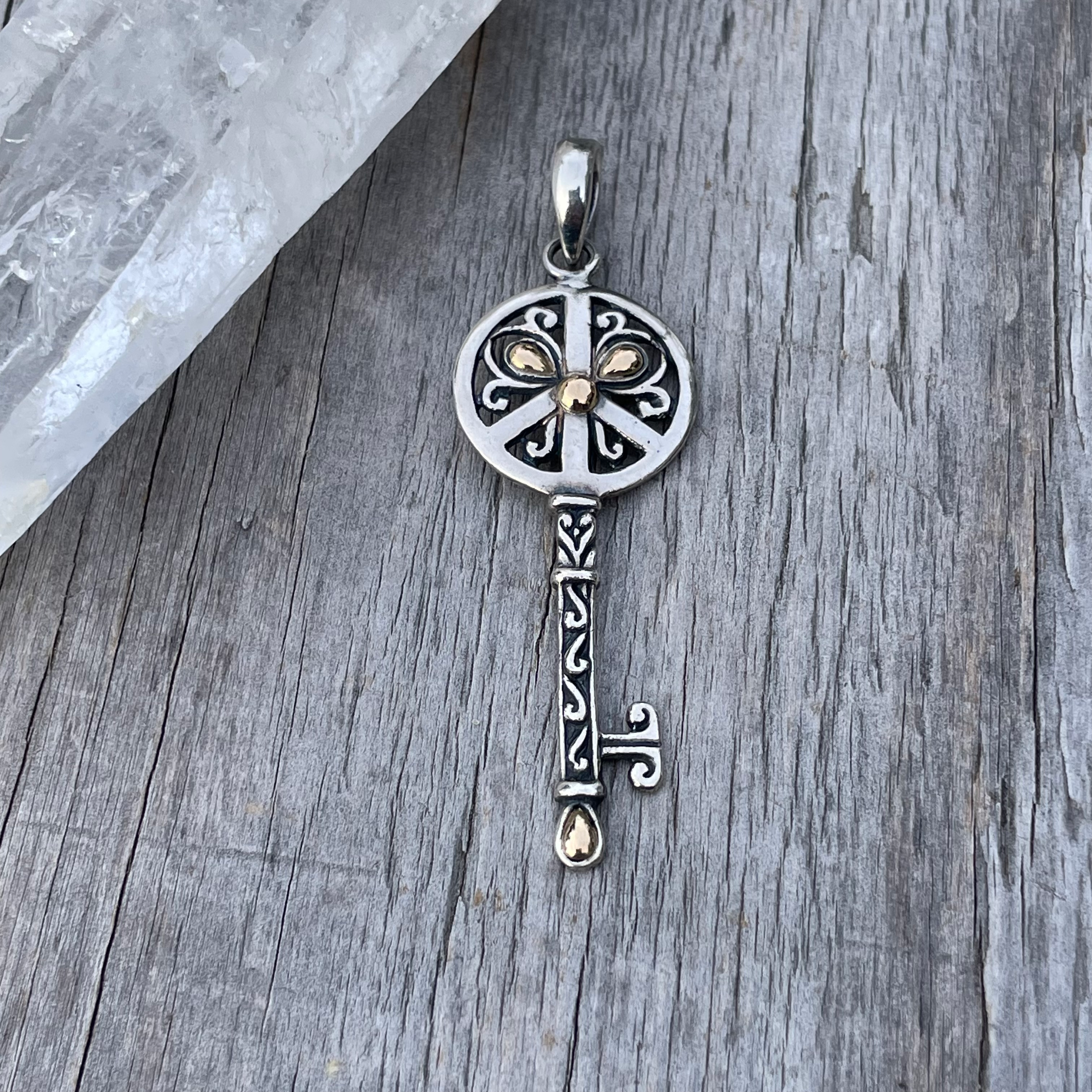 Silver and gold key pendant