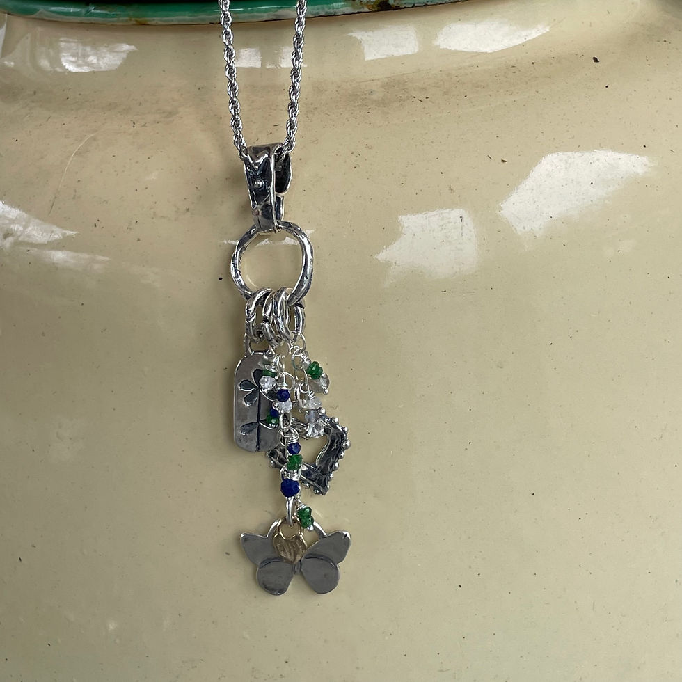 Thumbnail: GenVie Designs lucky charm pendant