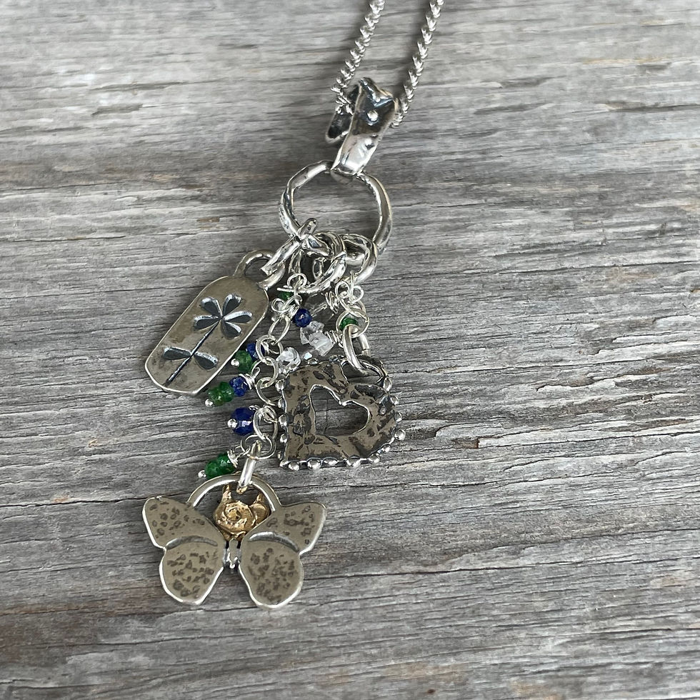 Thumbnail: GenVie Designs lucky charm pendant