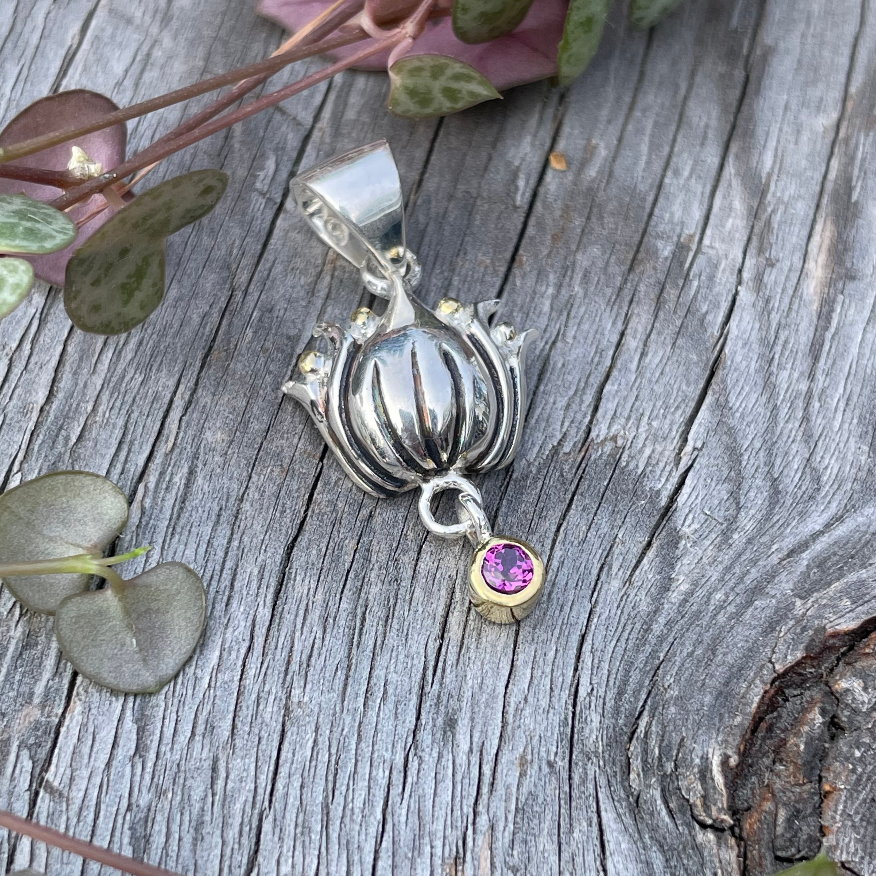 Roulette 18 lotus with garnet dangle pendant