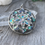Thumbnail: Round cutout paua shell pendant