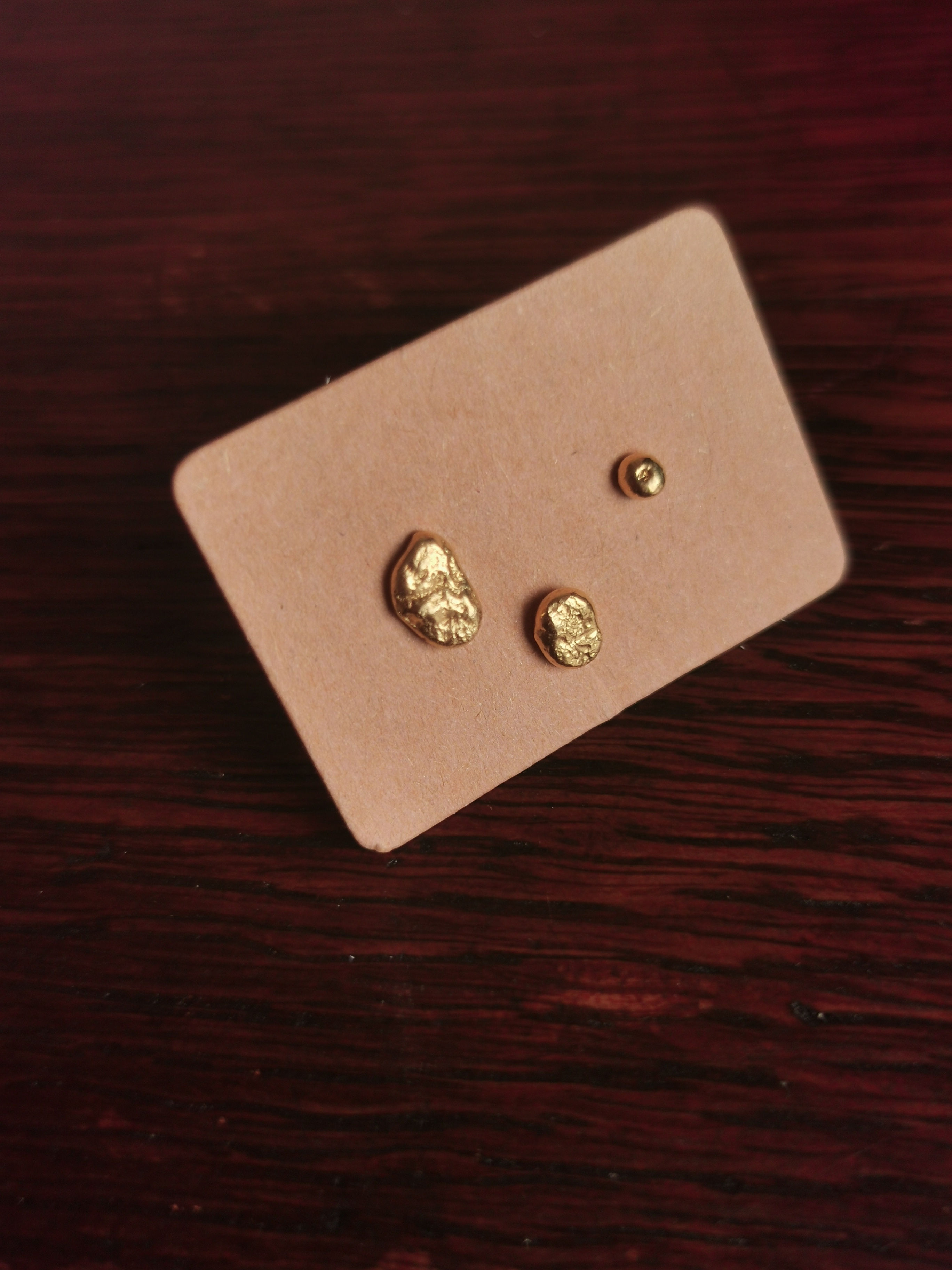 TRIO OF TEXTURED GOLD PLATED STUDS