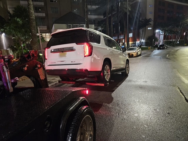 white car being towed