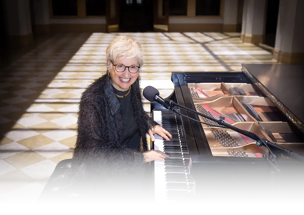 Cindy smiling at the piano