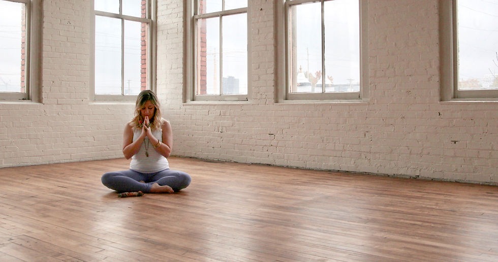 lady sitting cross legged on the floor