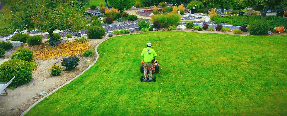 High angle view of a commercial property maintenance crew working on landscaping