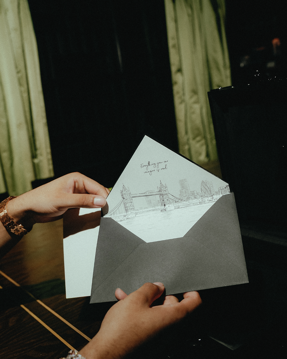 Matte black envelope featuring a hand-drawn London skyline, part of luxury packaging by Lost Archives.