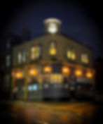 Our victoria co-op building lit up at night, taken from outside in the street.
