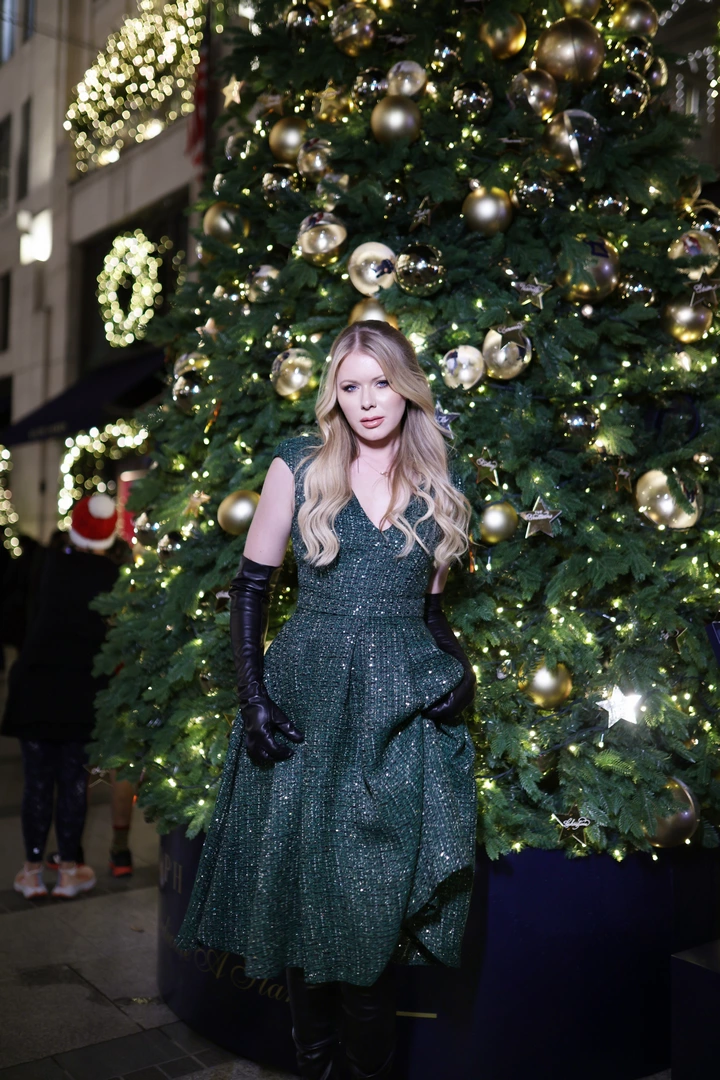 A girl poses outside the Ralph Lauren store