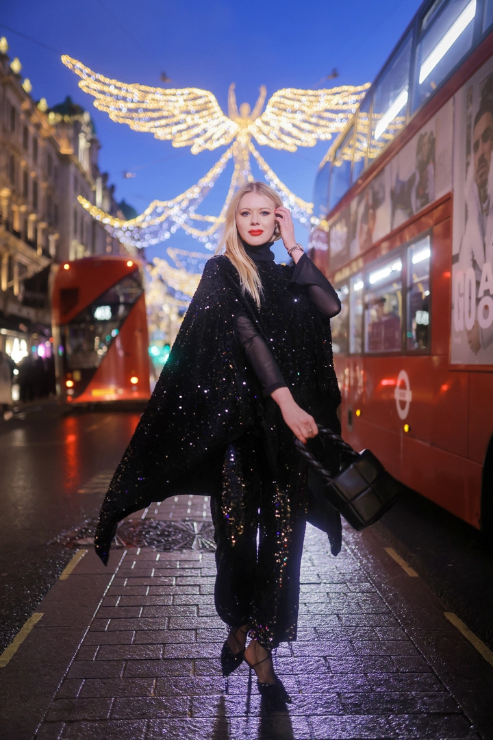 A girl poses for pictures on Regent Street