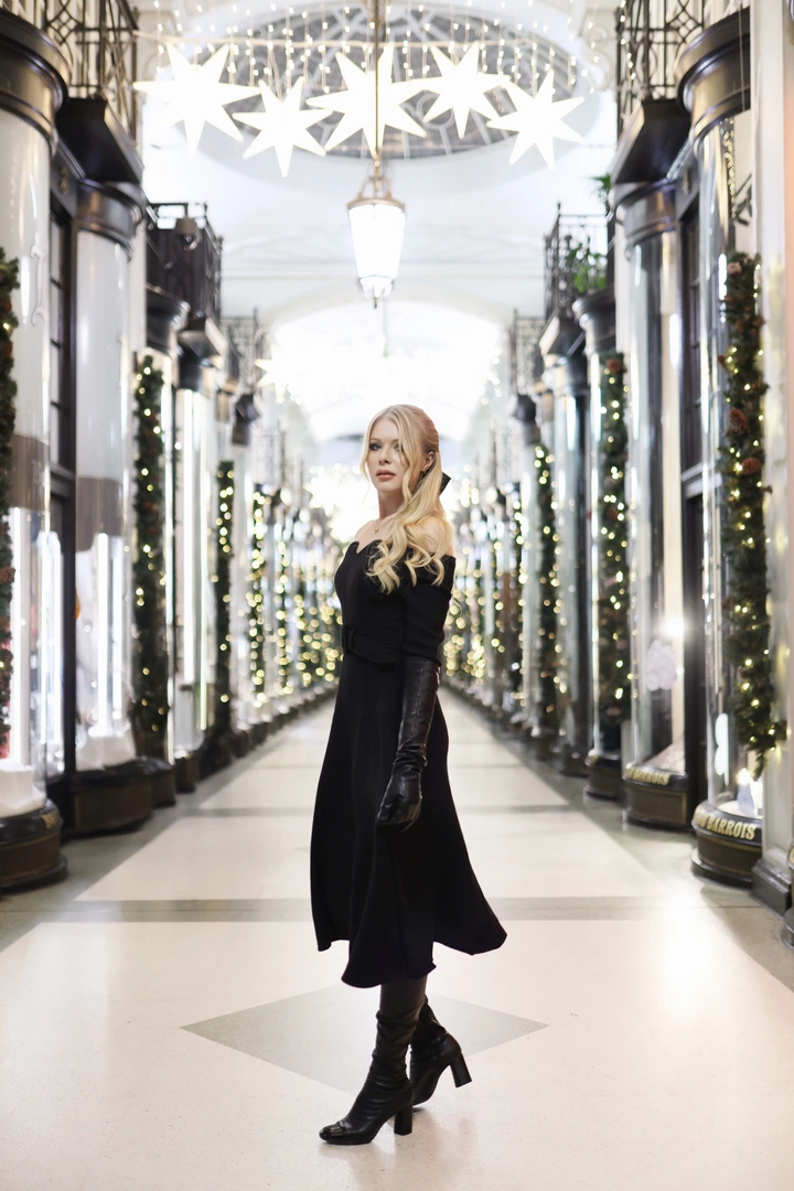A girl posing for a picture at the Burlington Arcade.