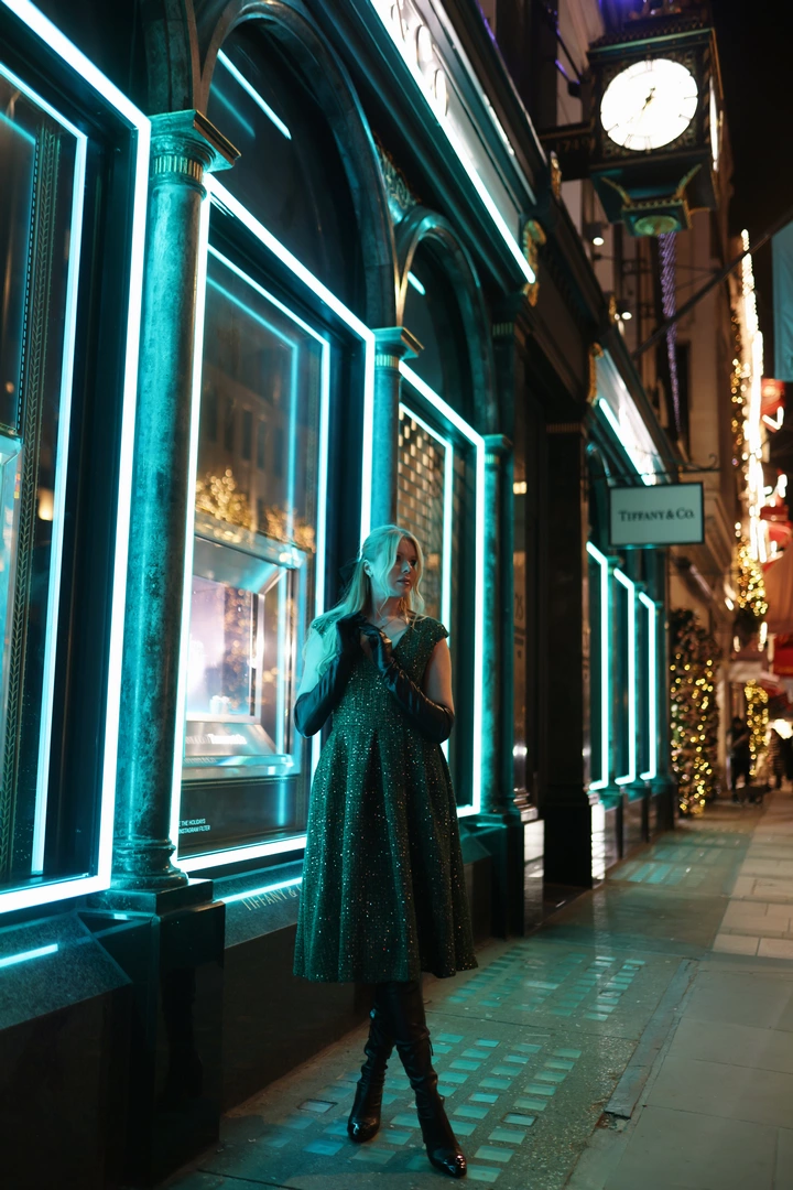 A girl poses for a photo outside a Tiffany store