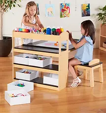 Children playing with an art table