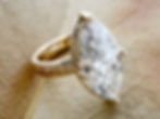 Custom engagement ring crafted to combine the marquise-cut diamond trend with vintage-inspired design.