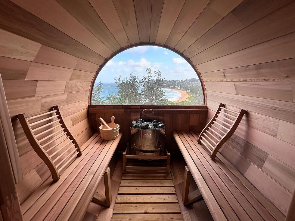 Vista Series cedar barrel sauna with rear window and front porch by Wandering Sauna