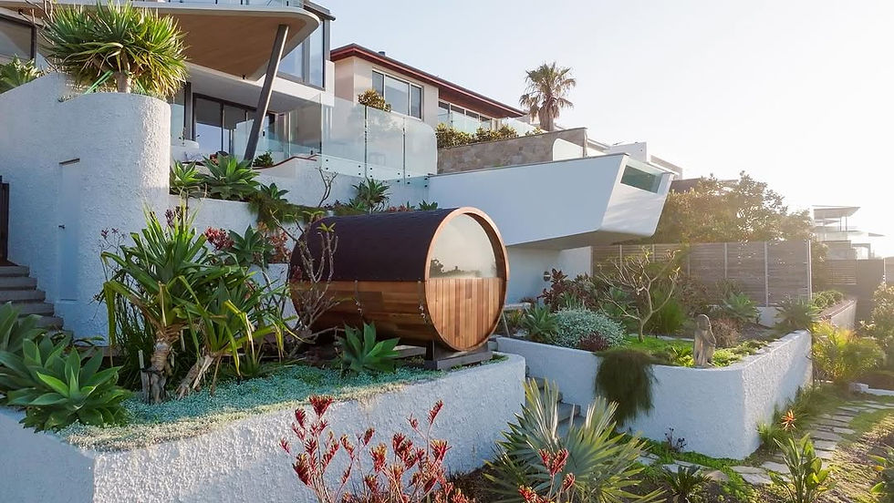 Vista Series cedar barrel sauna with rear window and front porch by Wandering Sauna