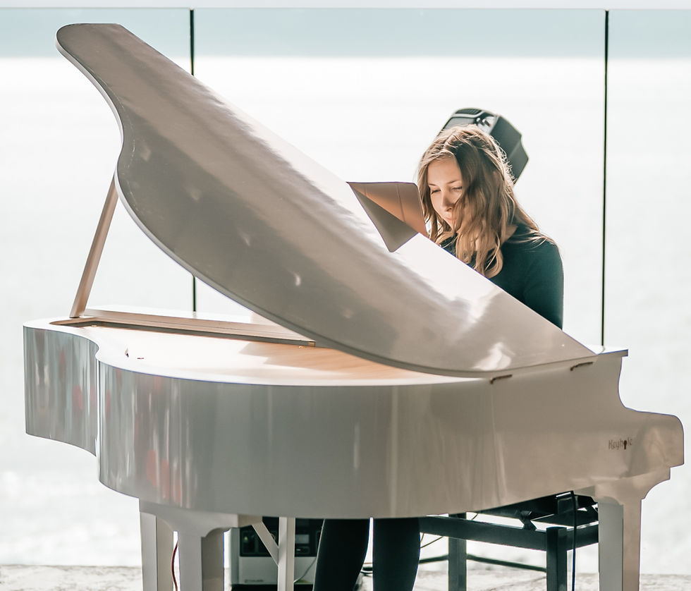 High angle view of a grand piano elegantly set up for an evening event.