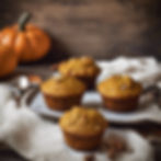healthy pumpkin spice muffins on pan with pumpkins in background
