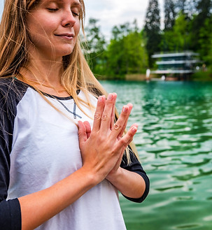 woman-meditating-by-a-tranquil-lake-2026-01-05-06-15-56-utc.jpg