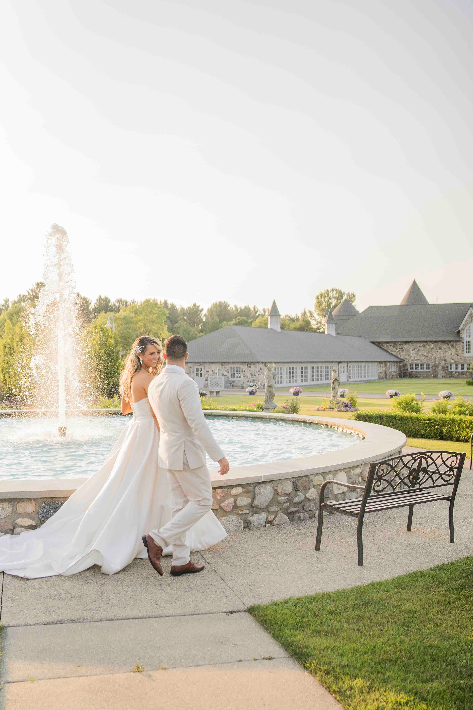 couple walking towards venue wedding photographs at Castle Farms