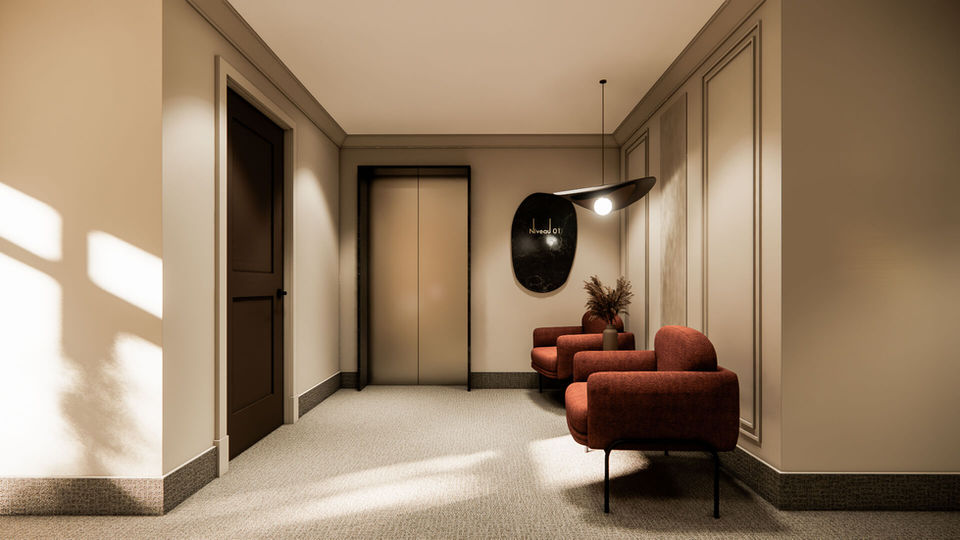 Hall d’entrée élégant avec ascenseur et coin détente dans l’immeuble Altitude 33 à Mirabel.