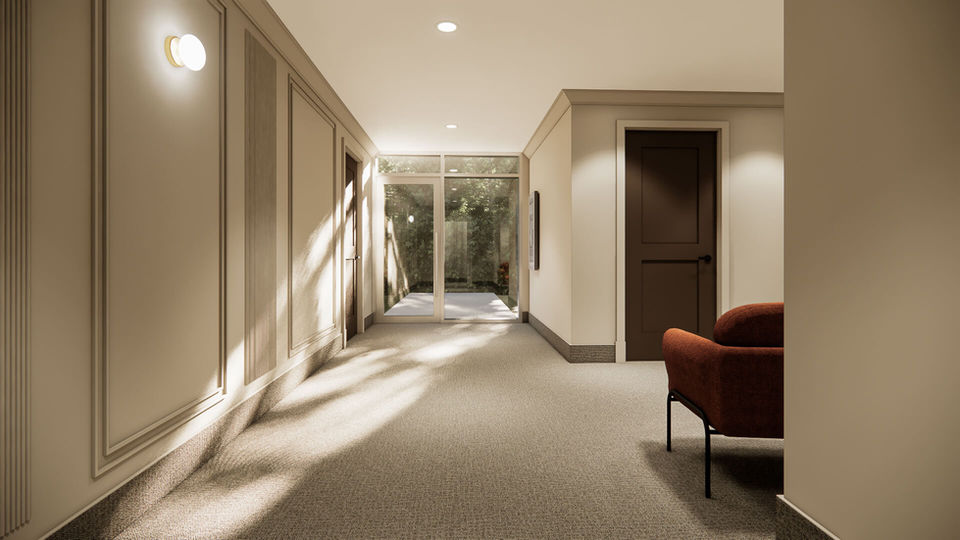 Espace commun lumineux avec accès extérieur dans l’immeuble Altitude 33 à Mirabel.