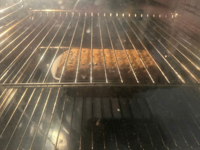A fruit cake in the oven.