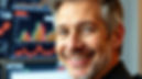 a professional 55 year old male investor with a nice smile facing us_screens with investme