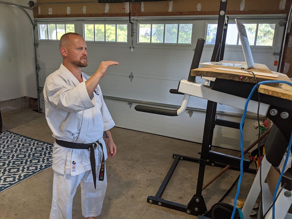 Sensei Black Belt teaches karate zoom class in garage gym dojo
