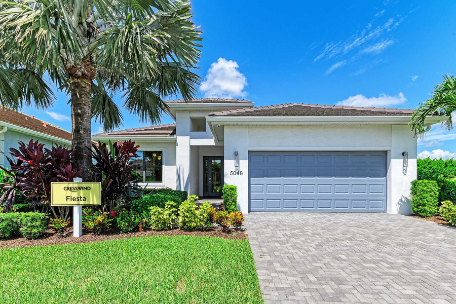 Model home in a Manatee County residential community with manicured landscaping