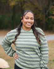 Team members at (RE) EMBELLISHED & COMPANY creating a welcoming boutique shopping experience in downtown Fayetteville, GA