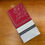 Thumbnail: Tissus Toselli Olivia RedGray Napkin folded