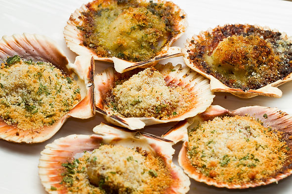 Scallops with a herb and parmesan crust.