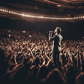 Singer achieving their dream of performing to an audience on a stage.jpg