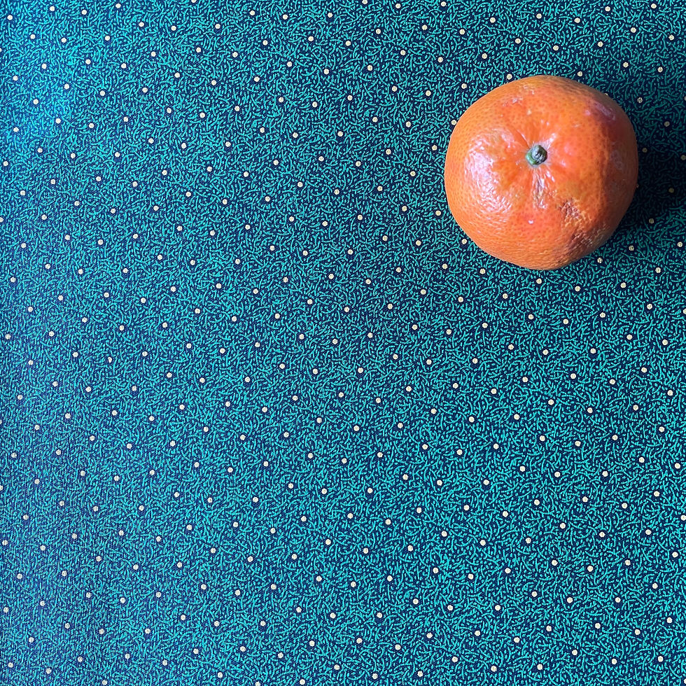 Thumbnail: Green Meadow Shweshwe fabric with orange for scale