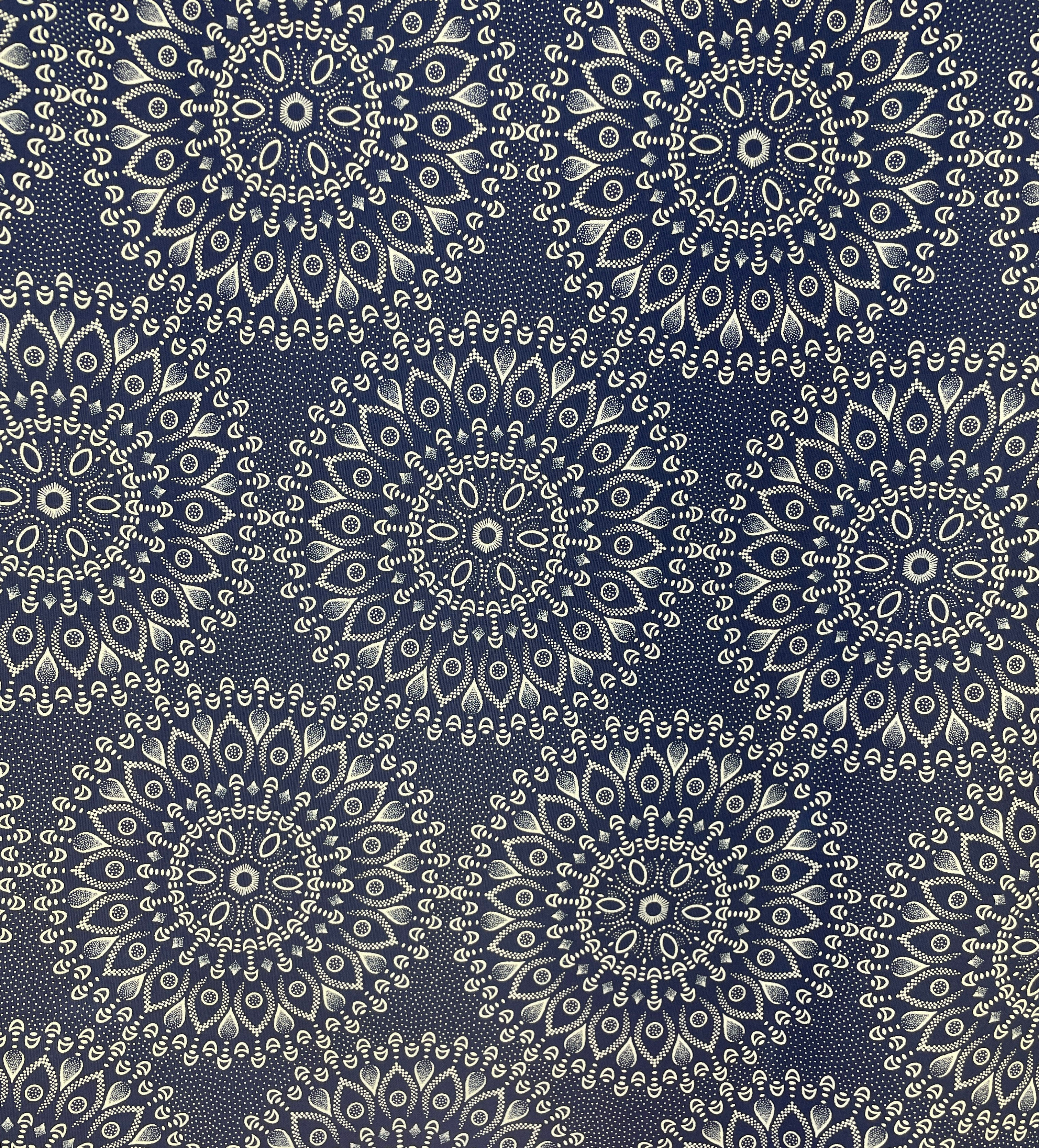 Close-up of Indigo Mandalas Shweshwe fabric showing detailed cream mandala pattern
