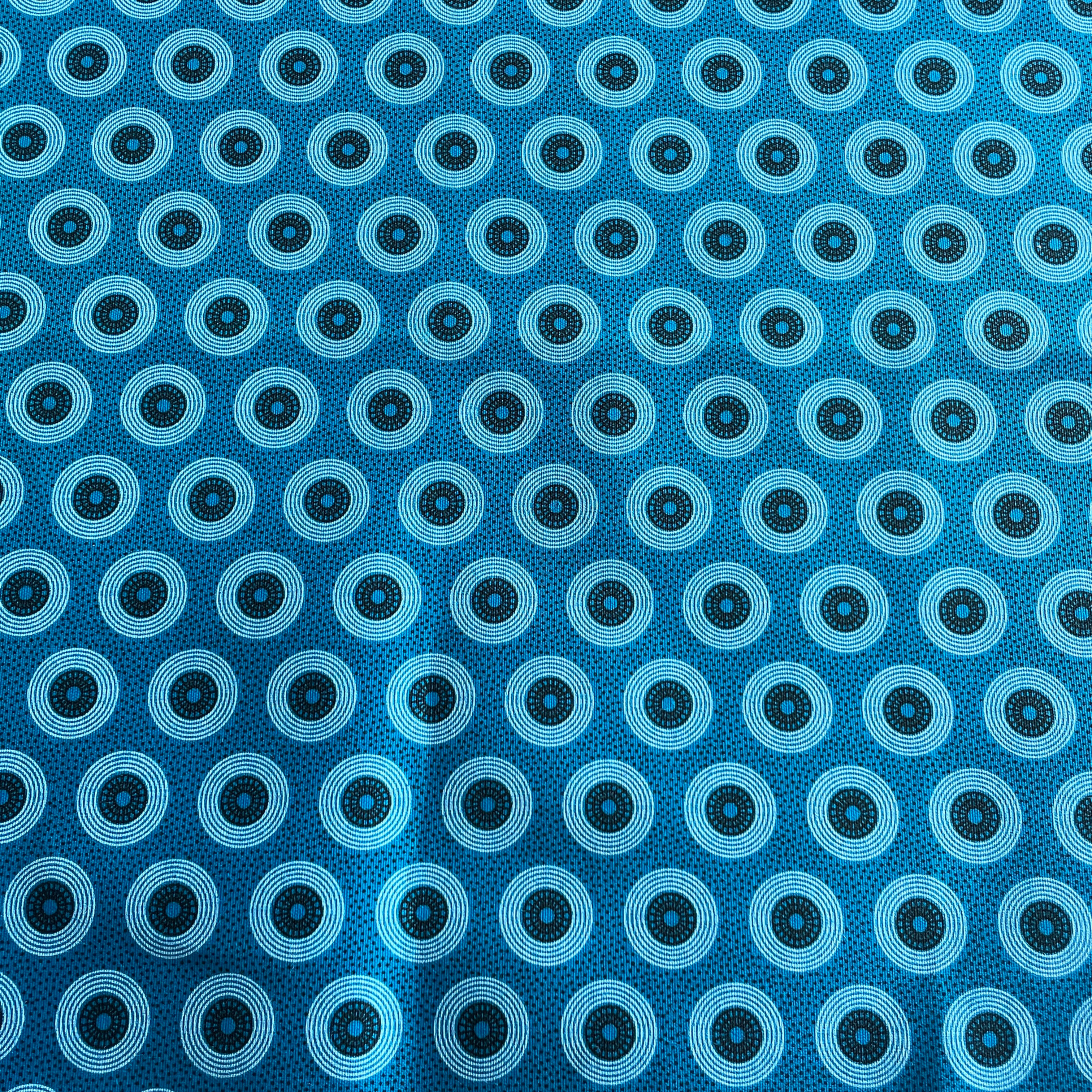 Turquoise Shweshwe fabric – full view wheels design, Da Gama Three Cats