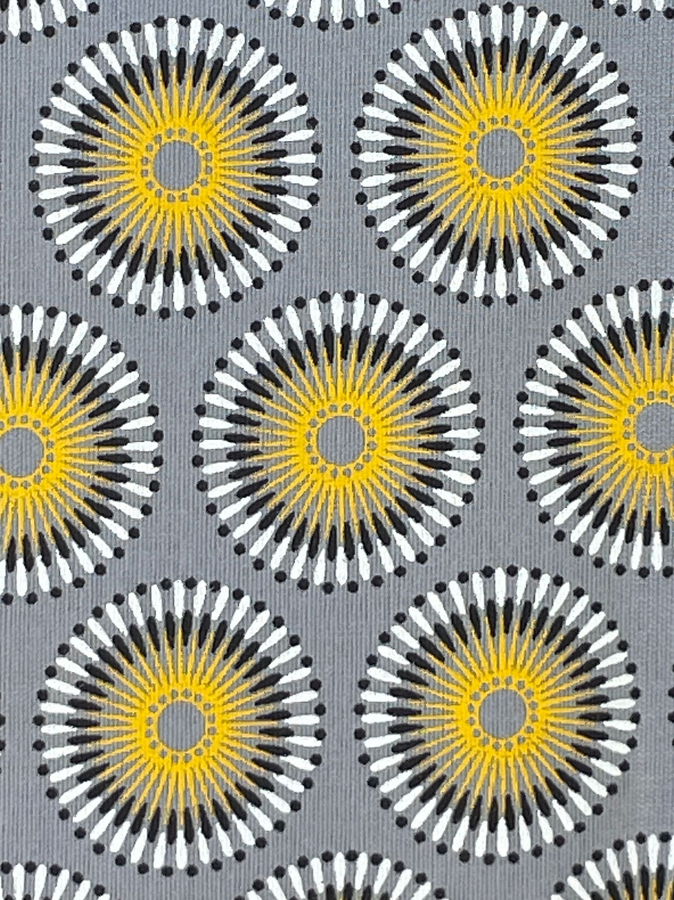 Close-up of Grey Chrysanthemums Shweshwe fabric showing yellow black and white floral pattern
