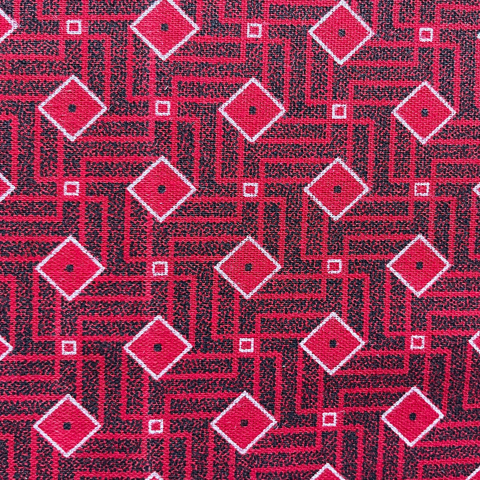 Close up of red diamond stripe Shweshwe detail