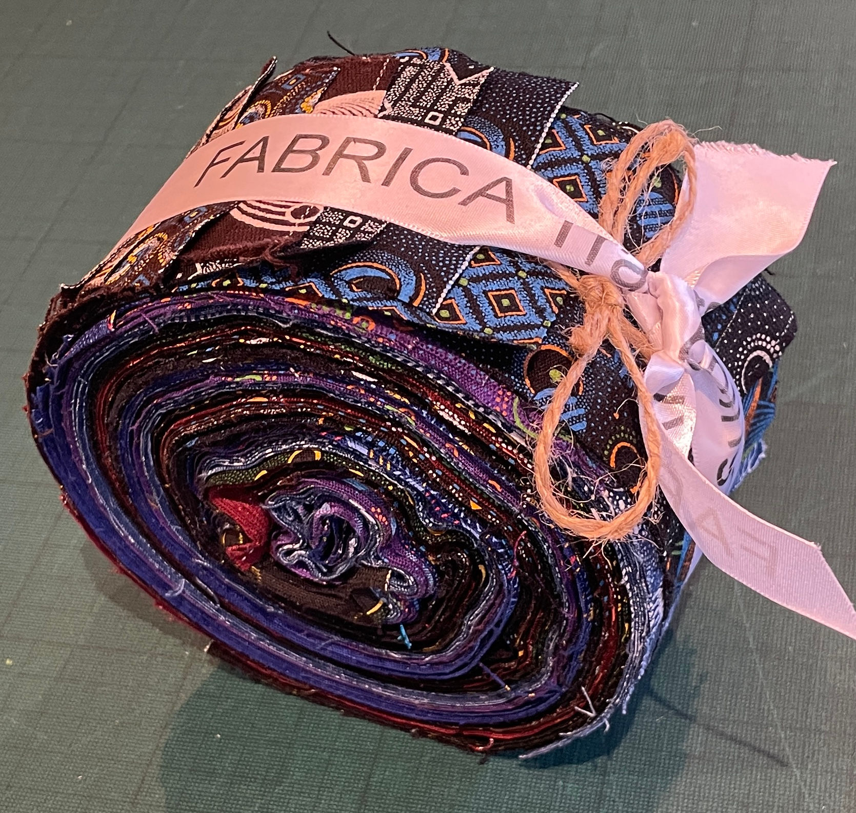 dark shweshwe fabric roll bundle in blue purple and red african prints