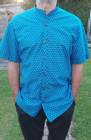 Mens casual shirt in stunnnigTurquoise Eyes Shweshwe fabric.