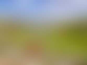 A female trekker sits overlooking Lac de Nino in Corsica on the GR20 hike