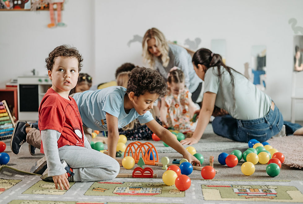 children in classroom playing with toys