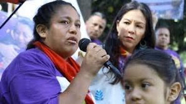 Woman janitor speaking rally justice Ya basta